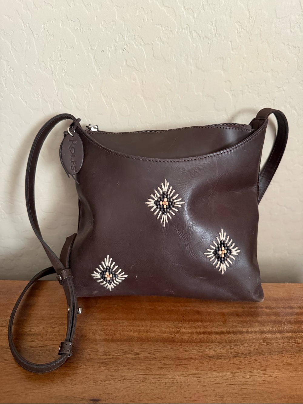 Rolfs brown leather crossbody purse with intricate beadwork